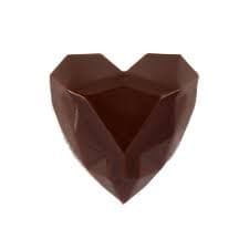 Beautifully presented heart-shaped chocolate bonbon with caramel filling demonstrating artisan design